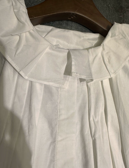 white midi dress with a crew neck and pleated lantern sleeves