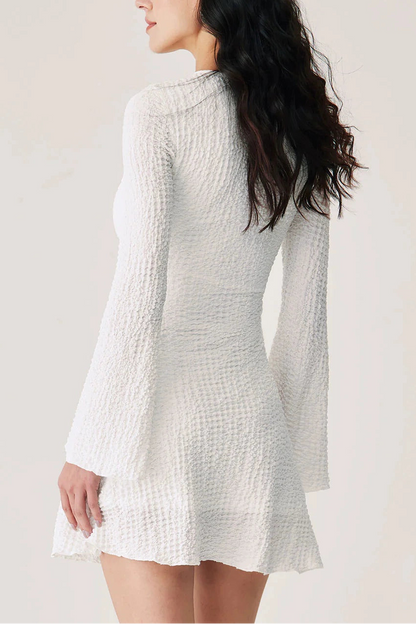 white textured pleated waist long sleeve dress