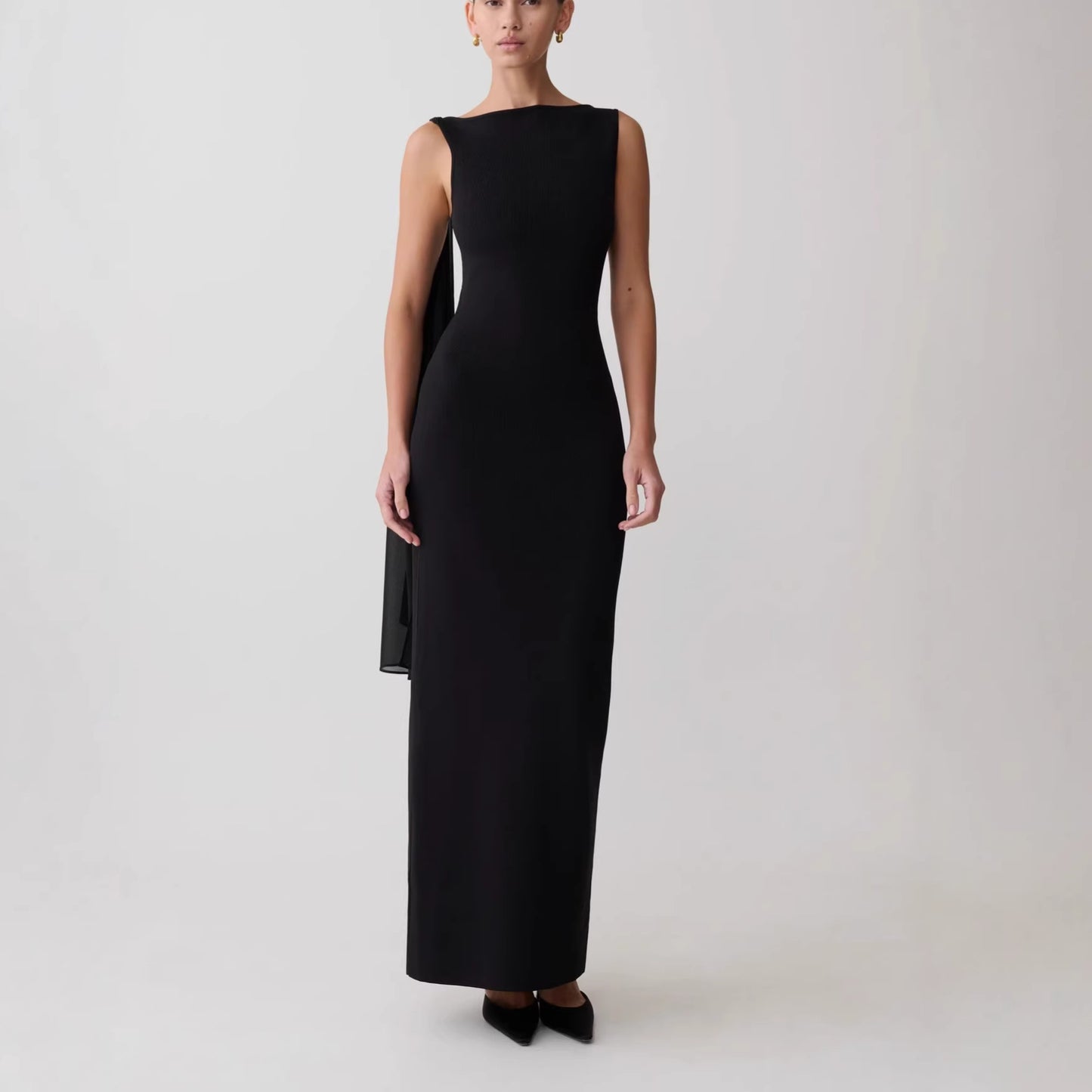 black one-shoulder streamer hip-hugging dress