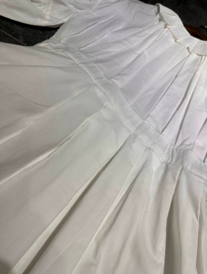 white midi dress with a crew neck and pleated lantern sleeves