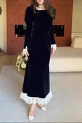 black long-sleeved waist-cinching dress