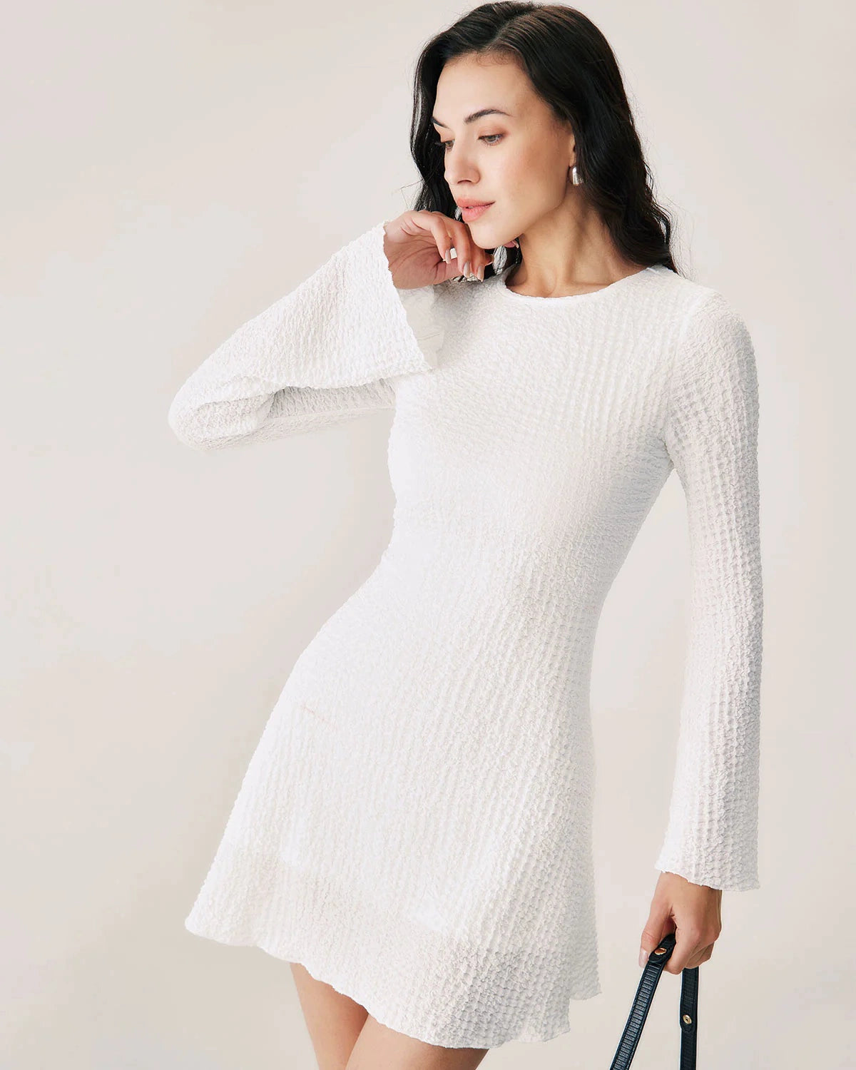 white textured pleated waist long sleeve dress