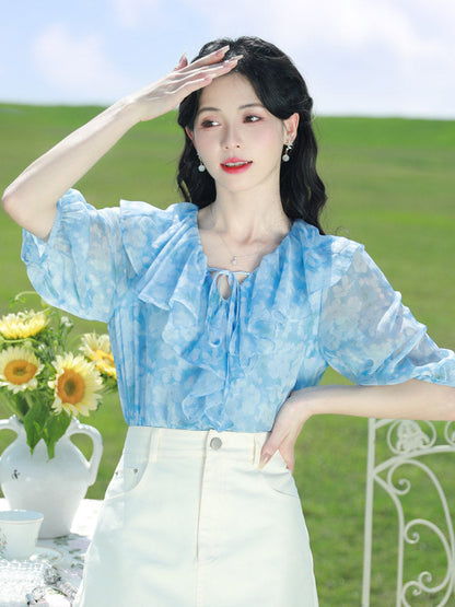 Blue floral chiffon blouse with ruffled V-neck