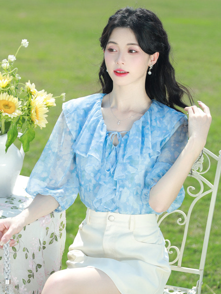 Blue floral chiffon blouse with ruffled V-neck