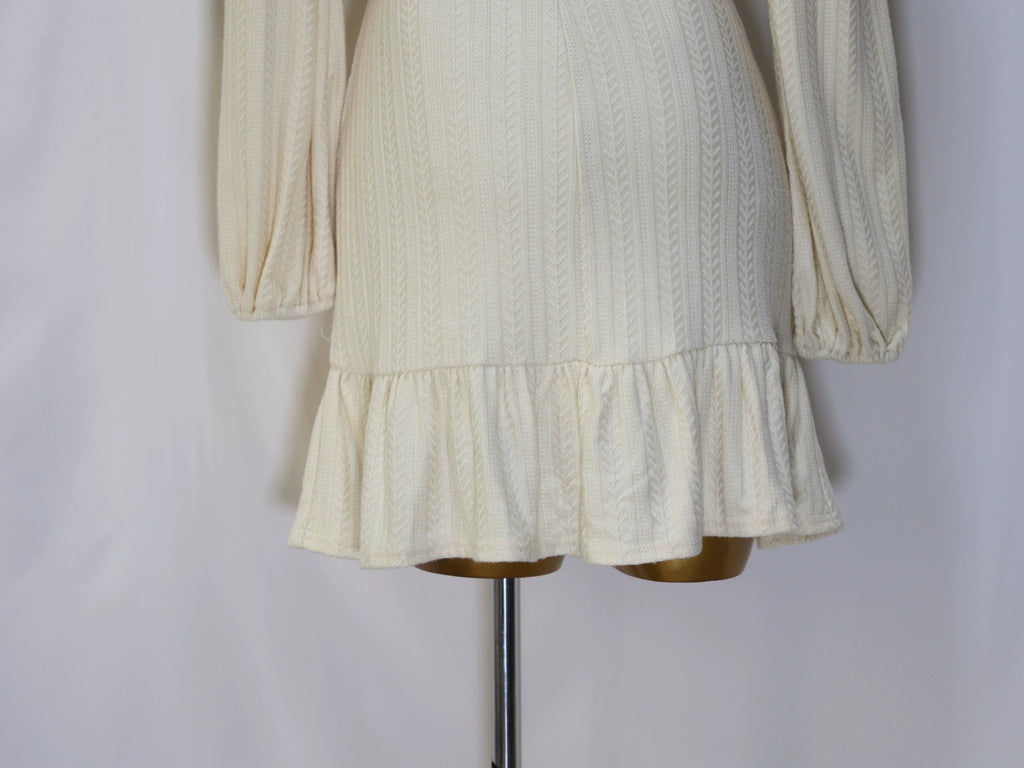 white long-sleeved mini dress