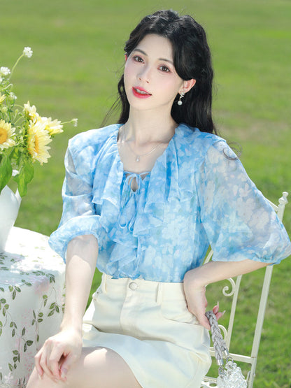 Blue floral chiffon blouse with ruffled V-neck