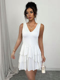 white V-neck low-cut halter top with ruffled hem mini dress