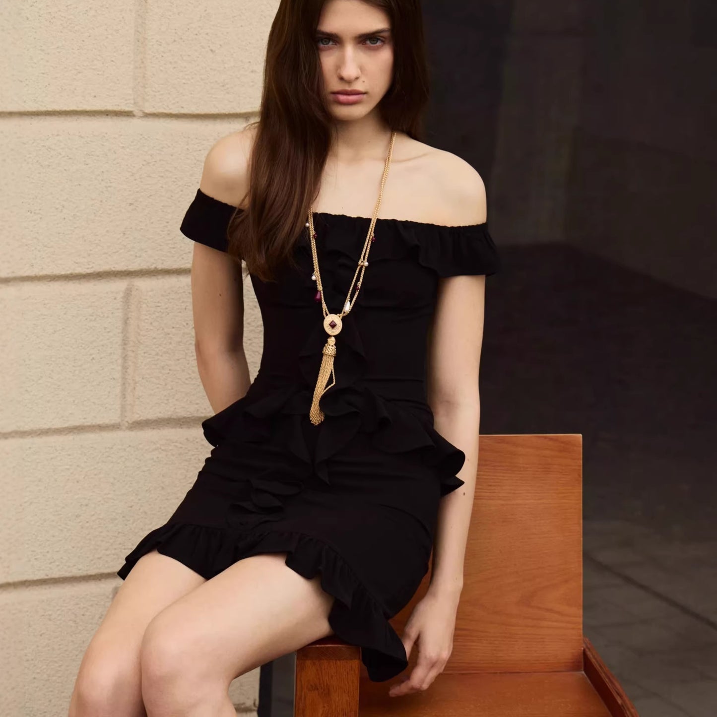 black one-shoulder ruffled mini dress
