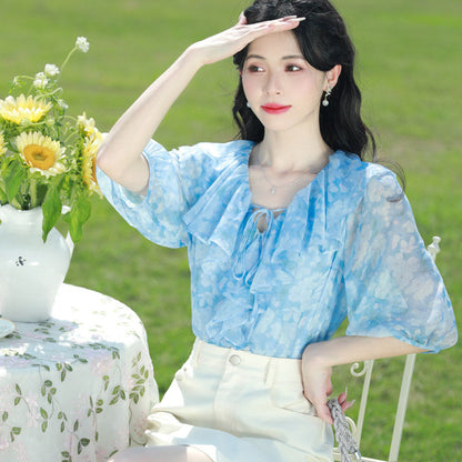 Blue floral chiffon blouse with ruffled V-neck