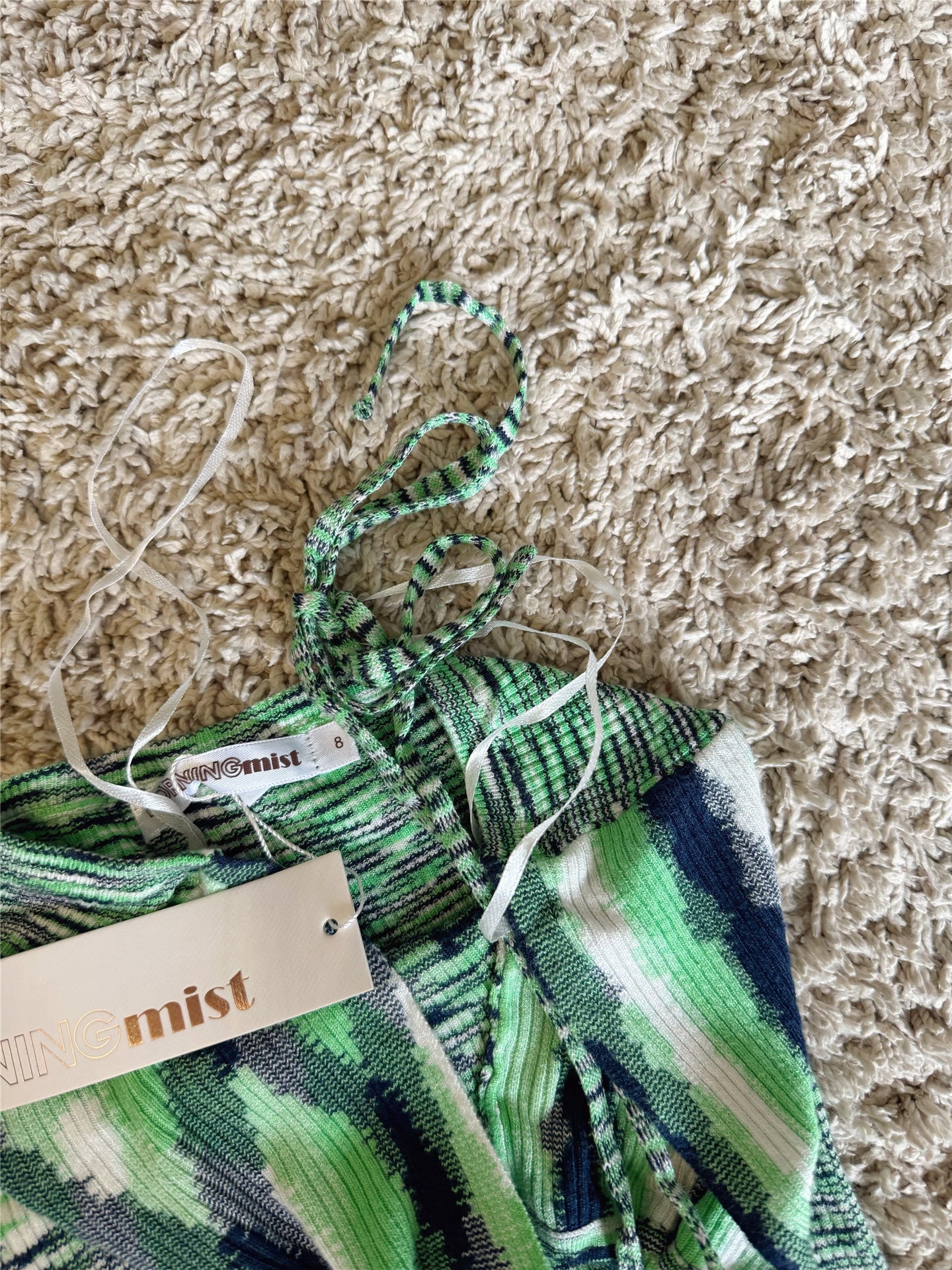green knitted halterneck lace-up wrap dress