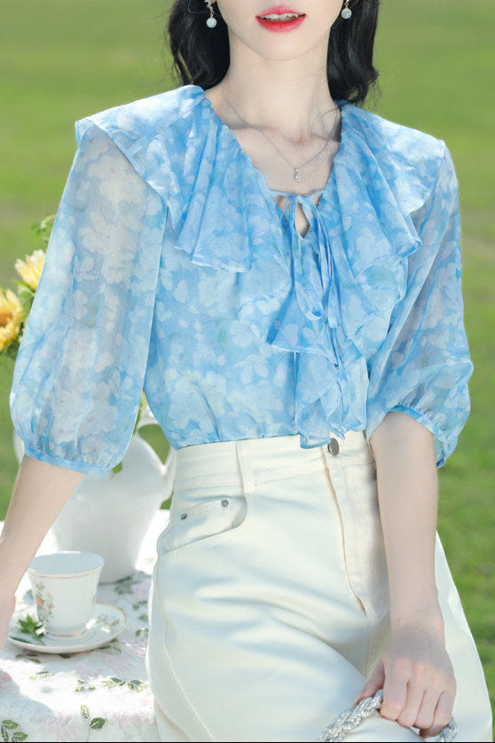Blue floral chiffon blouse with ruffled V-neck