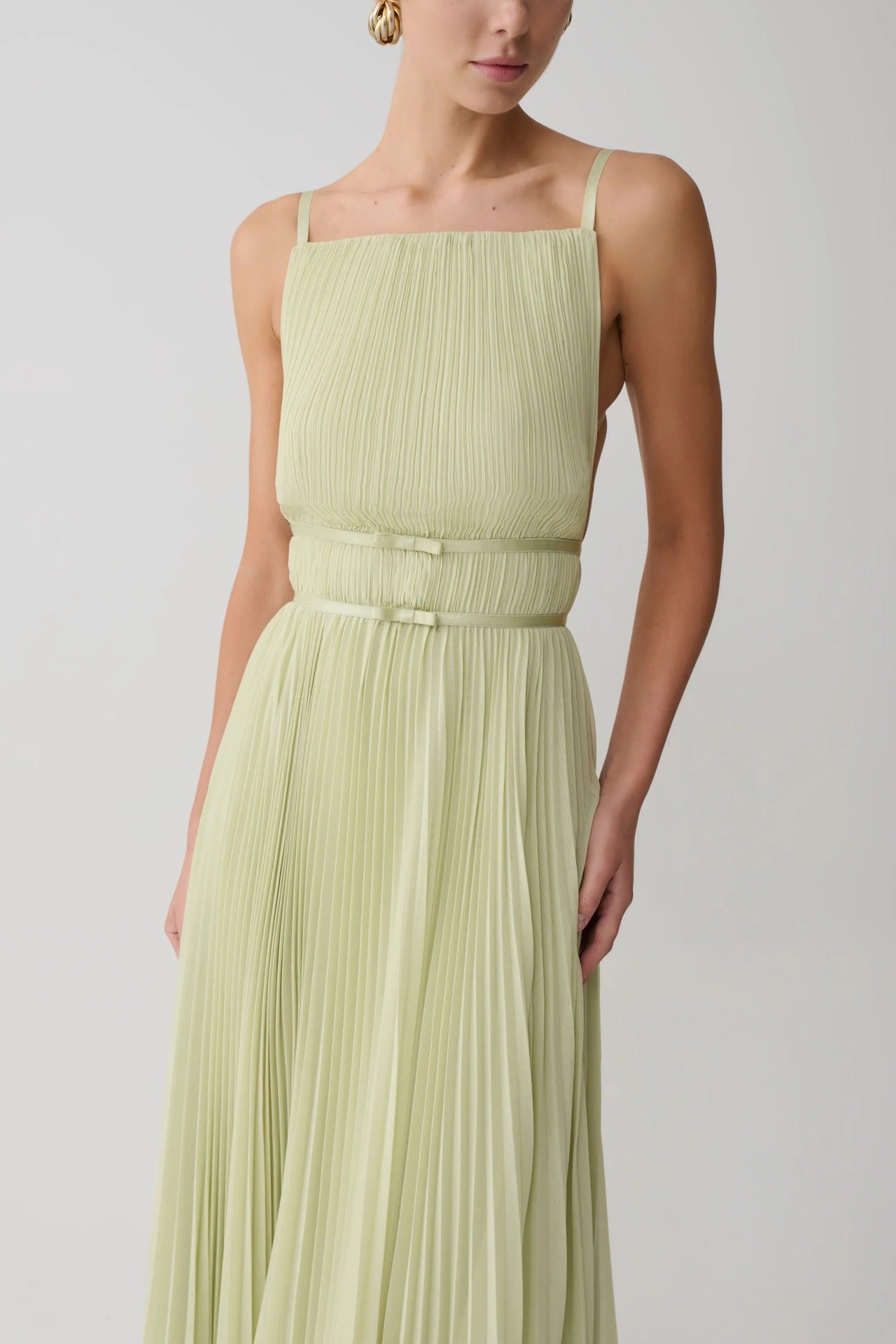 yellow pleated cinched backless slip dress