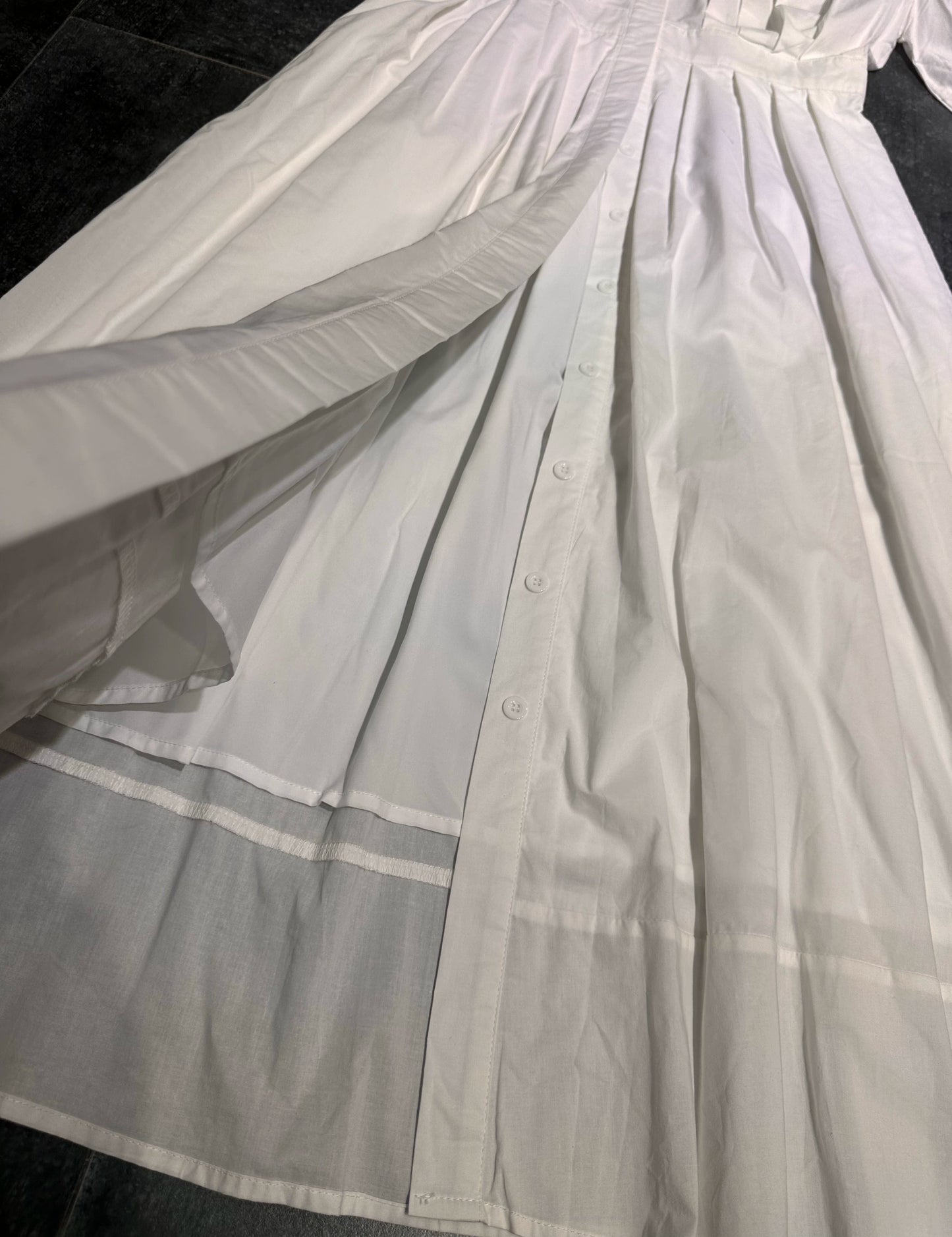 white midi dress with a crew neck and pleated lantern sleeves