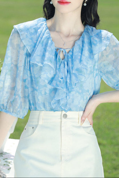 Blue floral chiffon blouse with ruffled V-neck