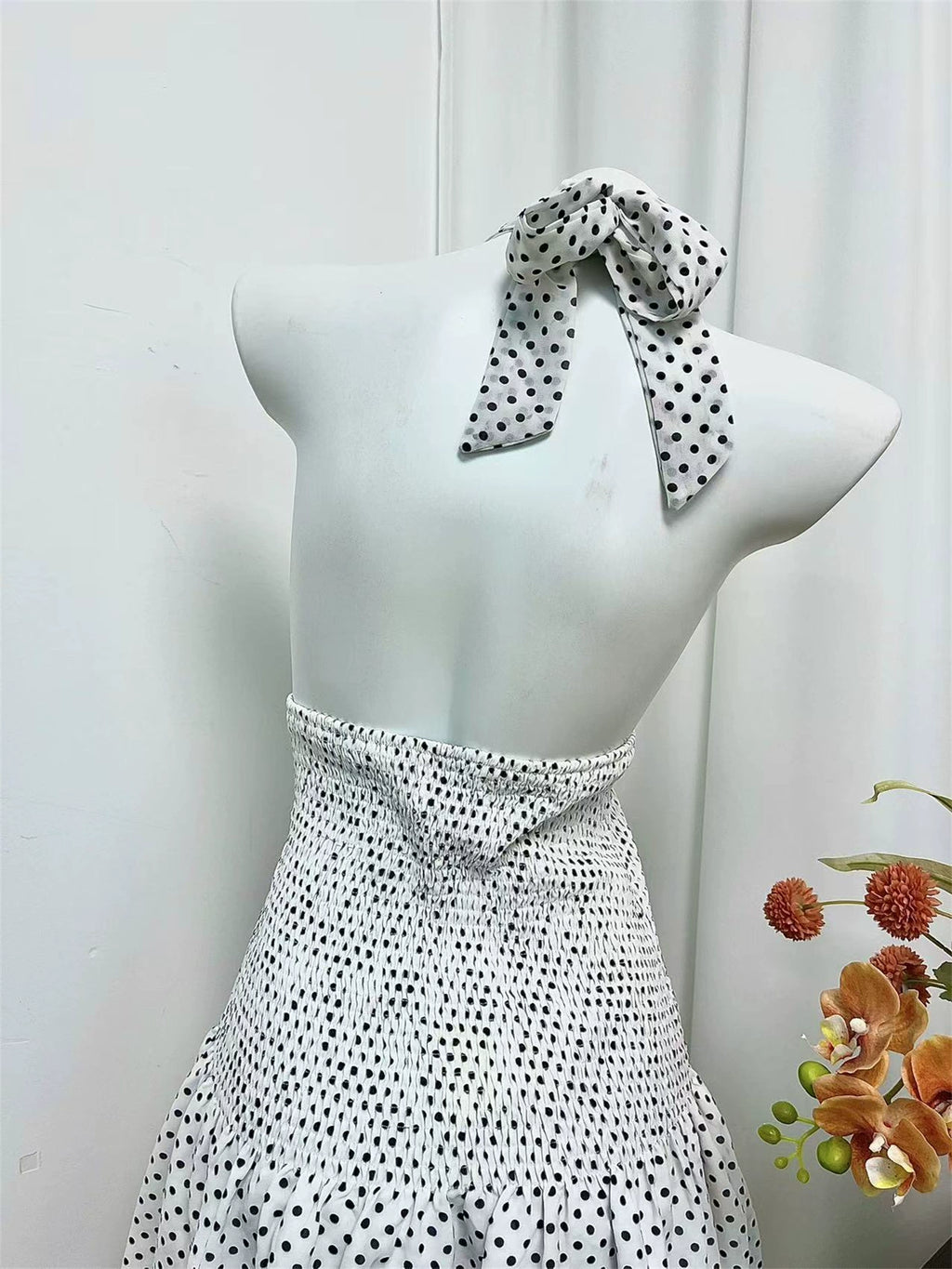 black polka dot halterneck open waist slap dress