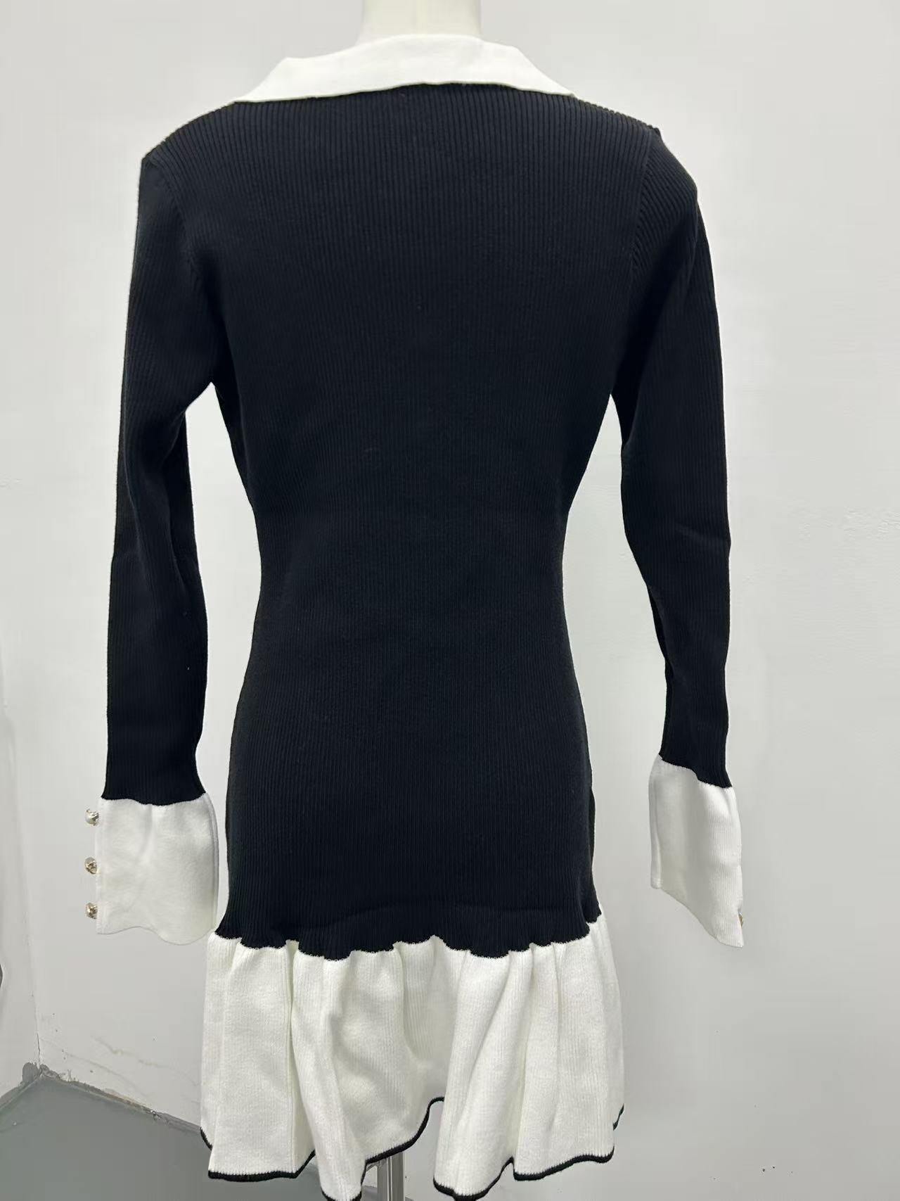 Black and white long-sleeved knitted ruffled mini dress